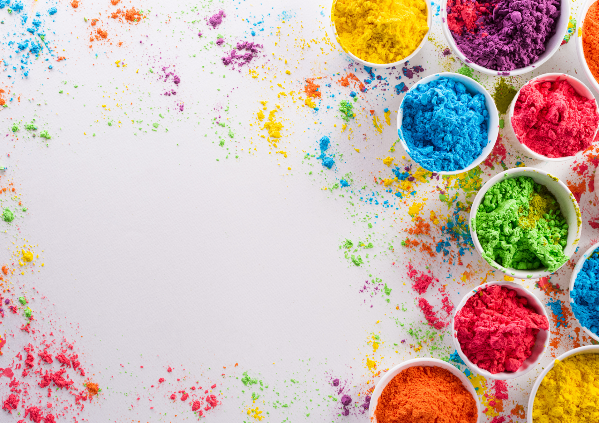 White table with coloured powder, rainbox colours
