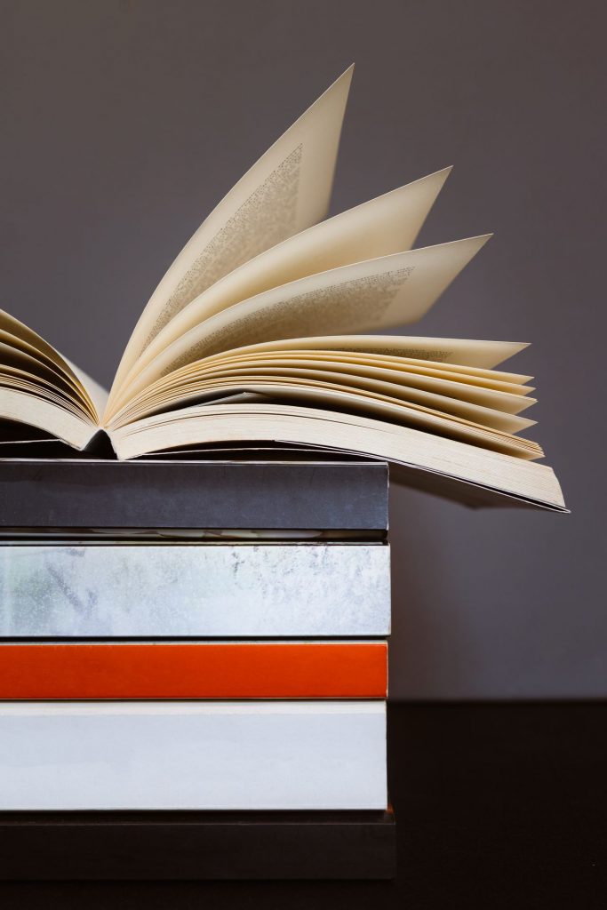 Open book sitting on top of red and blue and white